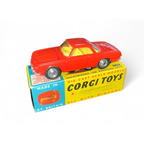 94 - Corgi No. 239 Volkswagen 1500 Karmann Ghia, red with yellow interior, spare wheel, small suitcase an... 