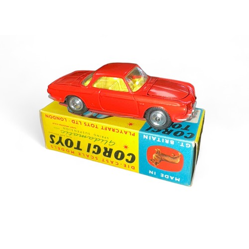 94 - Corgi No. 239 Volkswagen 1500 Karmann Ghia, red with yellow interior, spare wheel, small suitcase an... 