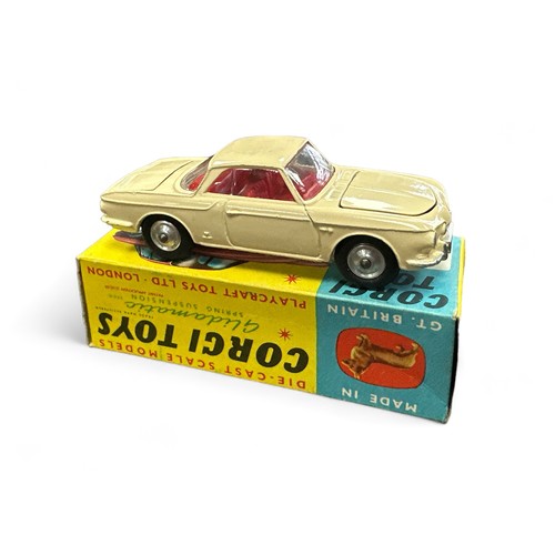 95 - Corgi No. 239 Volkswagen 1500 Karmann Ghia,  cream with red interior, spare wheel, small suitcase an... 