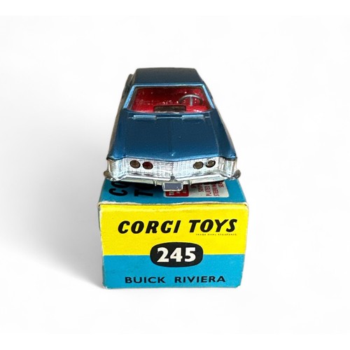 99 - Corgi Buick Riviera No. 245, metallic blue, red interior, tow bar and wire wheel-style hubs. Content... 