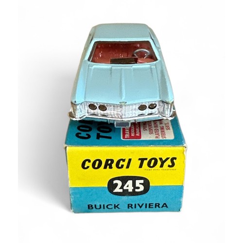 98 - Corgi Buick Riviera No. 245, pale blue, red interior, tow bar, wire wheel-style hubs and folded leaf... 