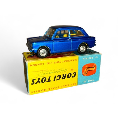 101 - Corgi Hillman Imp No. 251, metallic blue, lemon interior, large tan suitcase and spun hubs, excellen... 