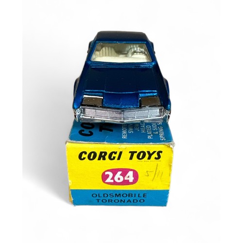 108 - Corgi Oldsmobile Toronado No. 264, metallic blue, cream interior and cast hubs, generally excellent ... 