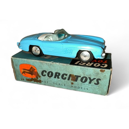 119 - Corgi Mercedes-Benz 300SL No. 303, light blue, white interior, flat hubs and folded leaflet, general... 