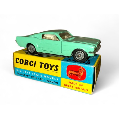 130 - Corgi Ford Mustang 2+2 No. 320, mint green, white interior, Corgi figure on rear shelf and wire whee... 