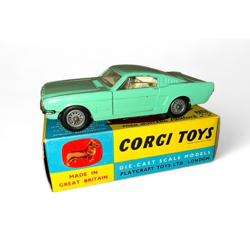 130 - Corgi Ford Mustang 2+2 No. 320, mint green, white interior, Corgi figure on rear shelf and wire whee... 