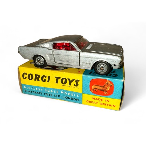 131 - Corgi Ford Mustang 2+2 No. 320, metallic silver, red interior, Corgi figure on back shelf and wire w... 