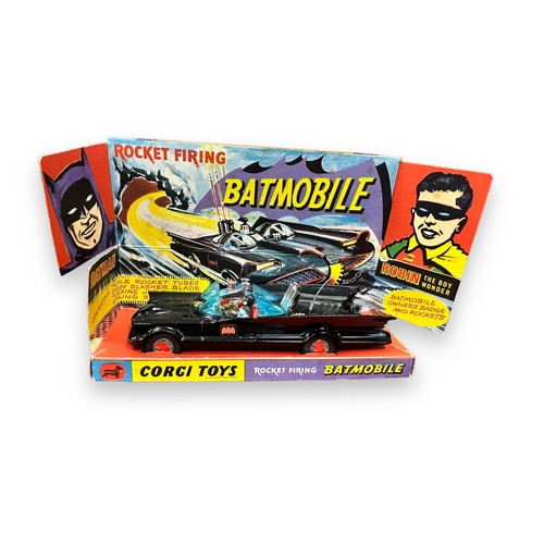 111 - Corgi Batmobile No. 267, early example with red Bat hubs, generally excellent in excellent to good p... 