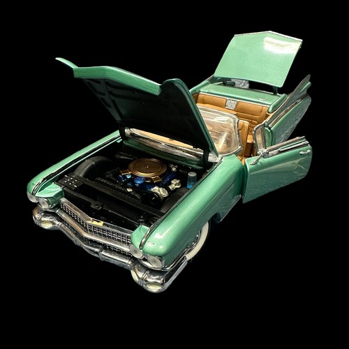 263 - Franklin Mint 1/24th scale 1959 Cadillac Eldorado Biarritz metallic green with tan interior No. B11E... 