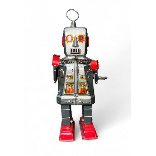 414 - KO (Japan) Sparky Robot tinplate clockwork with key, generally excellent to good plus. Contents unch... 