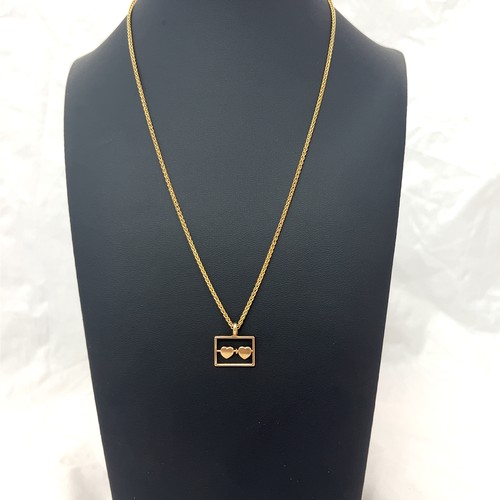 15 - 9ct gold pendant in the form of two hearts in a rectangle suspended from an 18ct gold chain. Total w... 