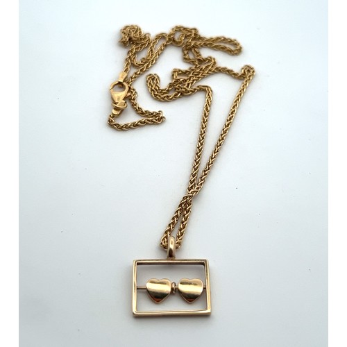 15 - 9ct gold pendant in the form of two hearts in a rectangle suspended from an 18ct gold chain. Total w... 