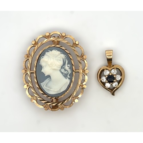 9 - A 9ct gold cameo brooch, 3 cm in length 3.62g. And a small 9ct sapphire and CZ heart pendant, 1g.  
... 