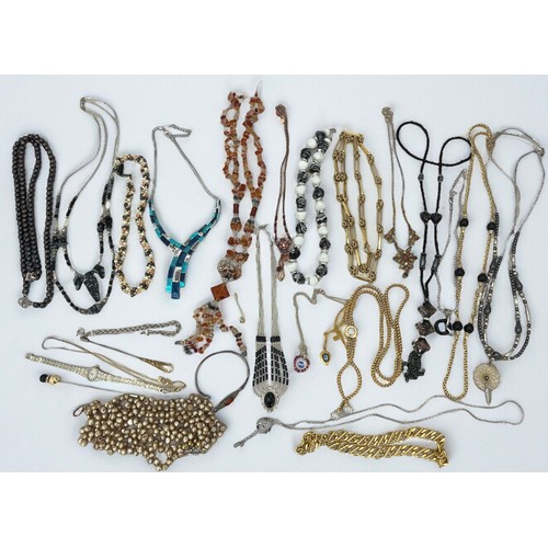 40 - An assortment of silver and costume jewellery. Includes a silver and amber bangle, a silver and blac... 