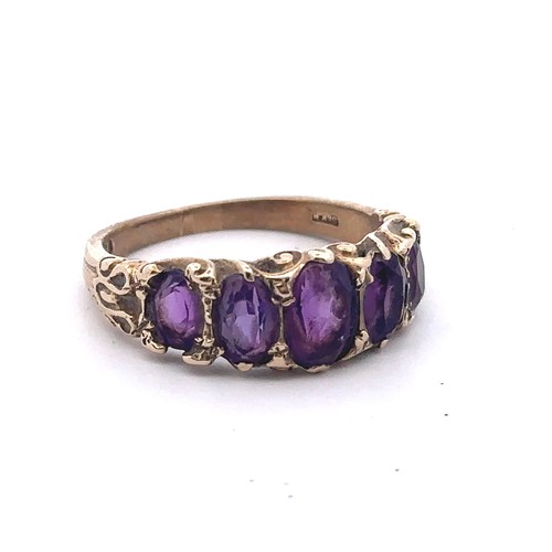 29 - A 1960s five stone amethyst ring set in 9ct gold with scroll shoulders, size N. Sponsor S&KH. Weight... 