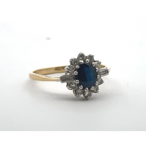 31 - An 18ct gold, sapphire and diamond cluster ring. Central oval sapphire surrounded by baguette and ro... 