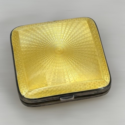 73 - A silver and double sided enamel compact by Henry Matthews, Birmingham 1929. Small area of damage to... 