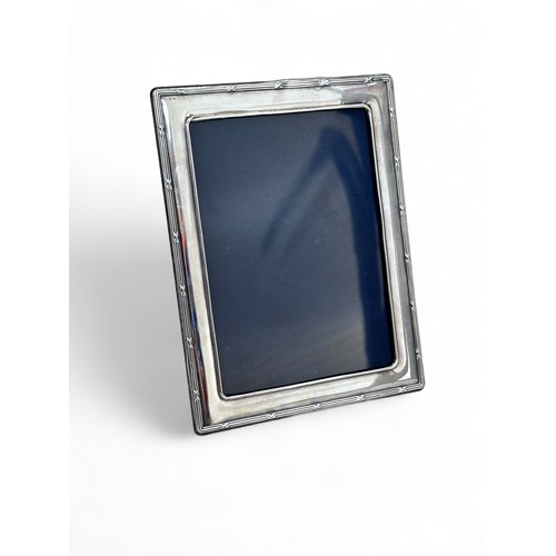 72 - A modern silver photo frame with hallmarks for Carr's of Sheffield Ltd,  2014. Frame 16cm x 21cm. Ap... 