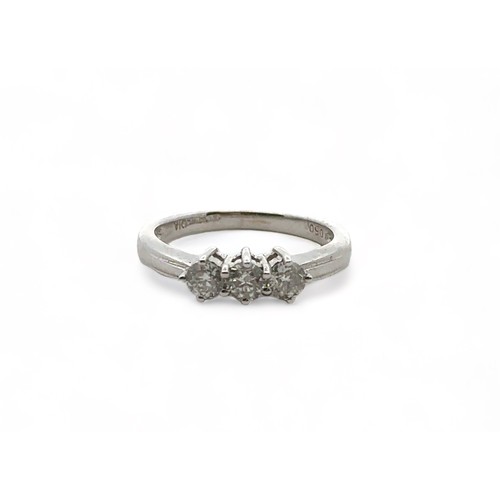 33 - An 18ct gold three stone diamond ring, size L.  Total diamond weight stamped on ring as 0.5ct. Spons... 