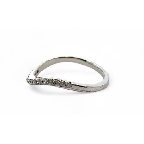 49 - A 9ct white gold and diamond wave shaped half eternity ring, size P. Sponsor CH, London assay mark. ... 