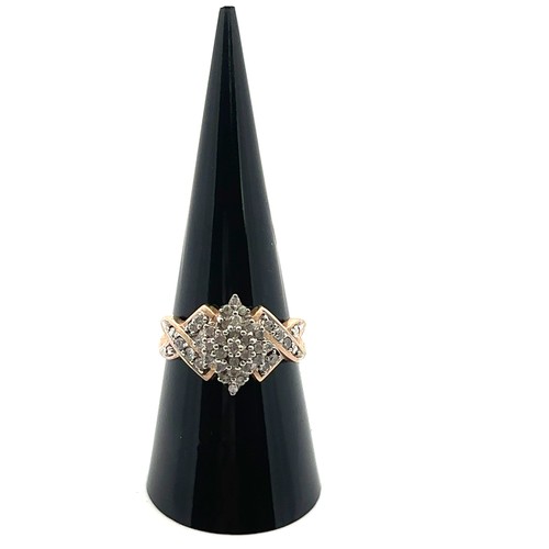 50 - A 9ct gold and diamond cluster ring. Size P. London import hallmark, sponsor TGCC.