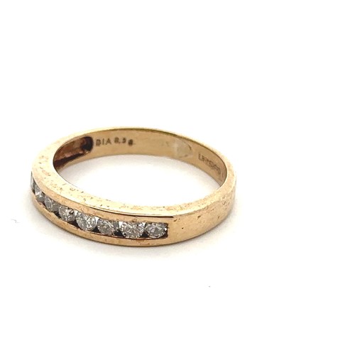 46 - A 9ct gold and diamond ring, set with 8 round brilliant cut diamonds in a row. London import hallmar... 