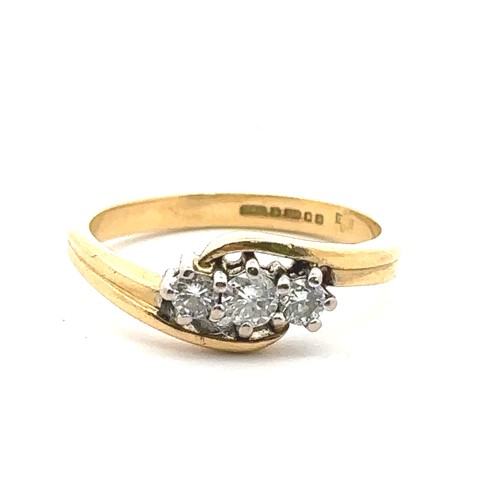 47 - An 18ct yellow gold three stone diamond ring, size J. Estimated diamond weight 0.24ct. London 2000 h... 