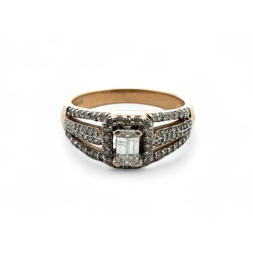 42 - A 9ct diamond cluster ring ring with central baguette cut diamond, size P. Baguette diamond 5.91mm x... 