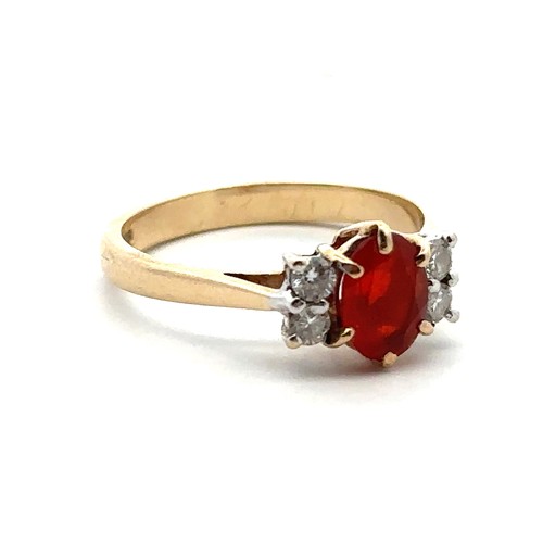 44 - A fire opal and diamond ring in hallmarked 9ct gold, size N.