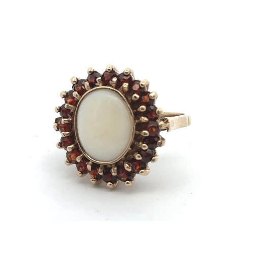 2 - A 9ct yellow gold opal and garnet cluster ring. Size P. Weight 6.42g.