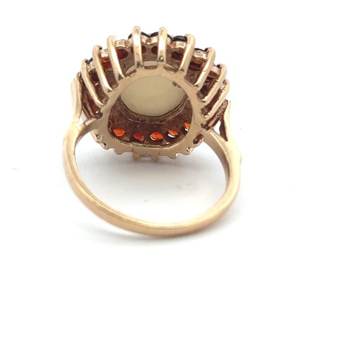 2 - A 9ct yellow gold opal and garnet cluster ring. Size P. Weight 6.42g.