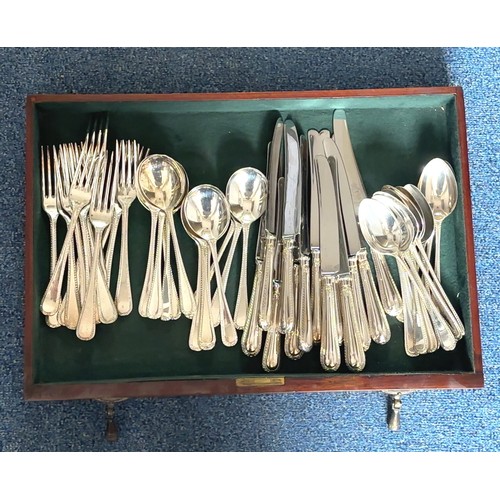 125 - A Sheffield silver plate set of cutlery and some additional silver plate cutlery/ untensils housed i... 