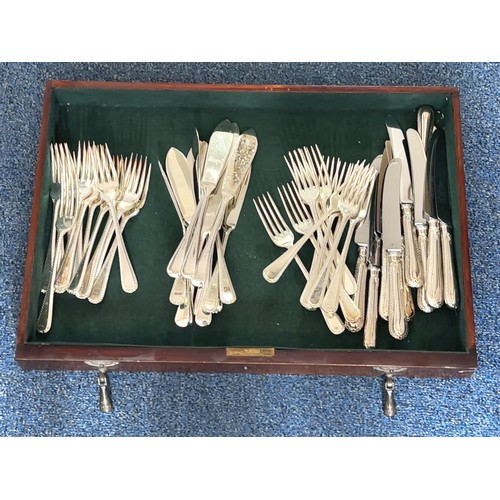 125 - A Sheffield silver plate set of cutlery and some additional silver plate cutlery/ untensils housed i... 