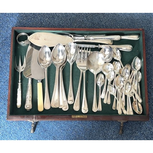 125 - A Sheffield silver plate set of cutlery and some additional silver plate cutlery/ untensils housed i... 