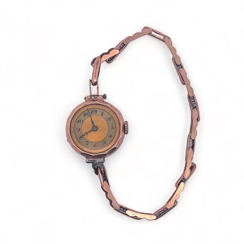 57 - A ladies 9ct gold watch on a spring loaded bracelet stamped 9ct. Watch stamped 375 on case, hallmark... 