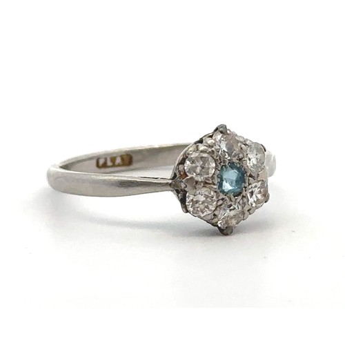 25 - An aquamarine and diamond flower ring stamped PLAT. Size L. Estimated diamond weight 0.36ct. Weight ... 