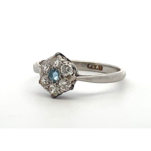 25 - An aquamarine and diamond flower ring stamped PLAT. Size L. Estimated diamond weight 0.36ct. Weight ... 