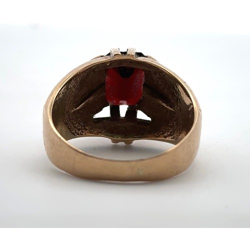 4 - A men's 9ct gold and garnet ring, size U. Birmingham hallmarks.