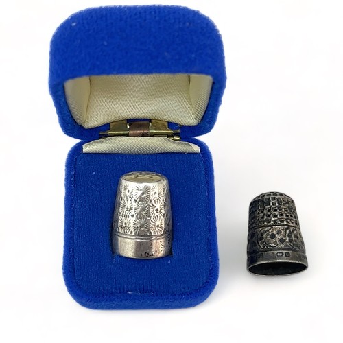 106 - Two silver thimbles. A Charles Horner DORCAS 8 thimble and a thimble by Olney, Amsden & Sons, Birmin... 