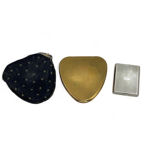 55 - Two compacts. A heart shaped gold-toned Kigu compact with white metal and marcasite decoration and w... 