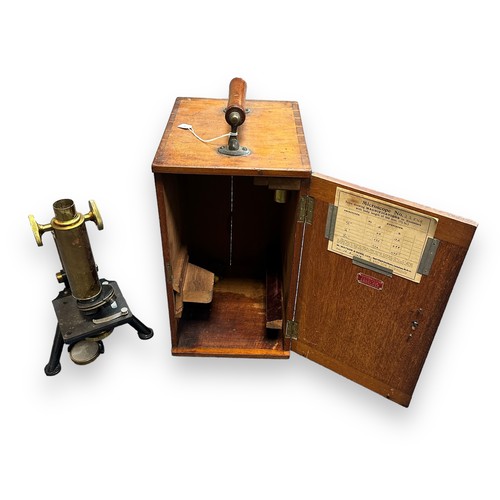 164 - W Watson & Glover Microscope Model Number 23549. Comes in a fitted wooden case with a range of lense... 