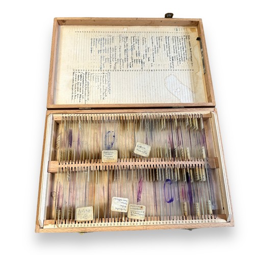 165 - J Swift & Son Microscope with fitted wooden case. Comes with a case of over 100 prepared slides cove... 