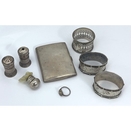 108 - Various hallmarked silver items including a cigarette case, two napkin rings, two salts, a broken bo... 