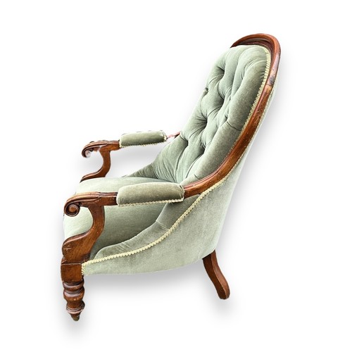 481 - Victorian mahogany upholstered spoonback armchair with green fabric, wheeled feet. Height 100cm, wid... 