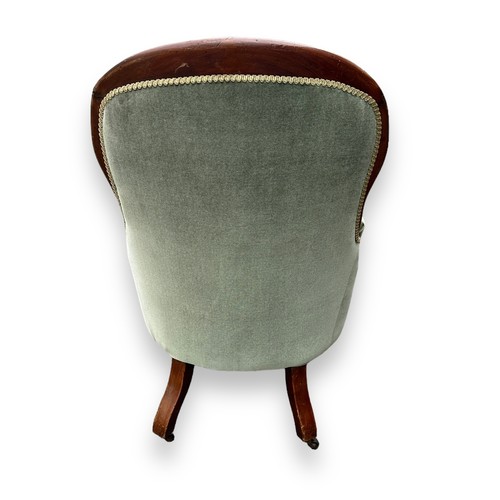 481 - Victorian mahogany upholstered spoonback armchair with green fabric, wheeled feet. Height 100cm, wid... 