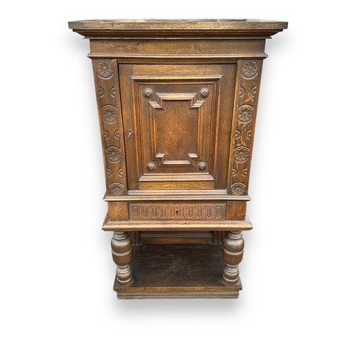 479 - 19th / 20th Century Danish reproduction oak cabinet with carved floral decoration to door, turned le... 