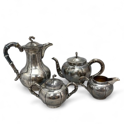 96 - A Chinese export silver four piece late 19th/early 20th Century tea service. Comprising of a tea pot... 