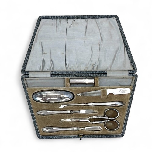 97 - A silver seven piece vanity set with hallmarks for William Devenport, Birmingham 1939.