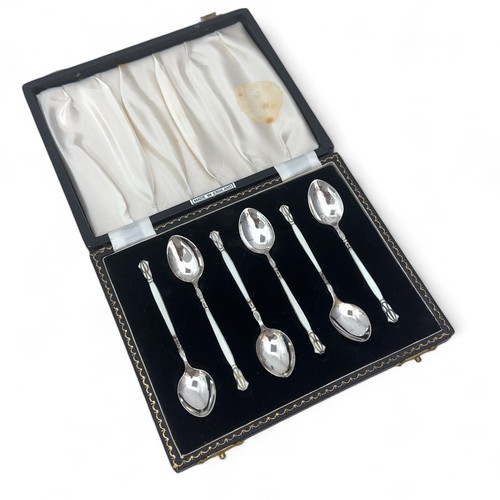 93 - A set of silver and enamel coffee spoons by Henry Clifford Davis, 1957. The obverse of each spoon is... 