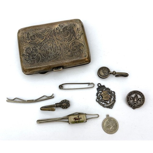 101 - Various hallmarked silver items including a cigarette case, napkin holder, medal/ fob, badge, as wel... 